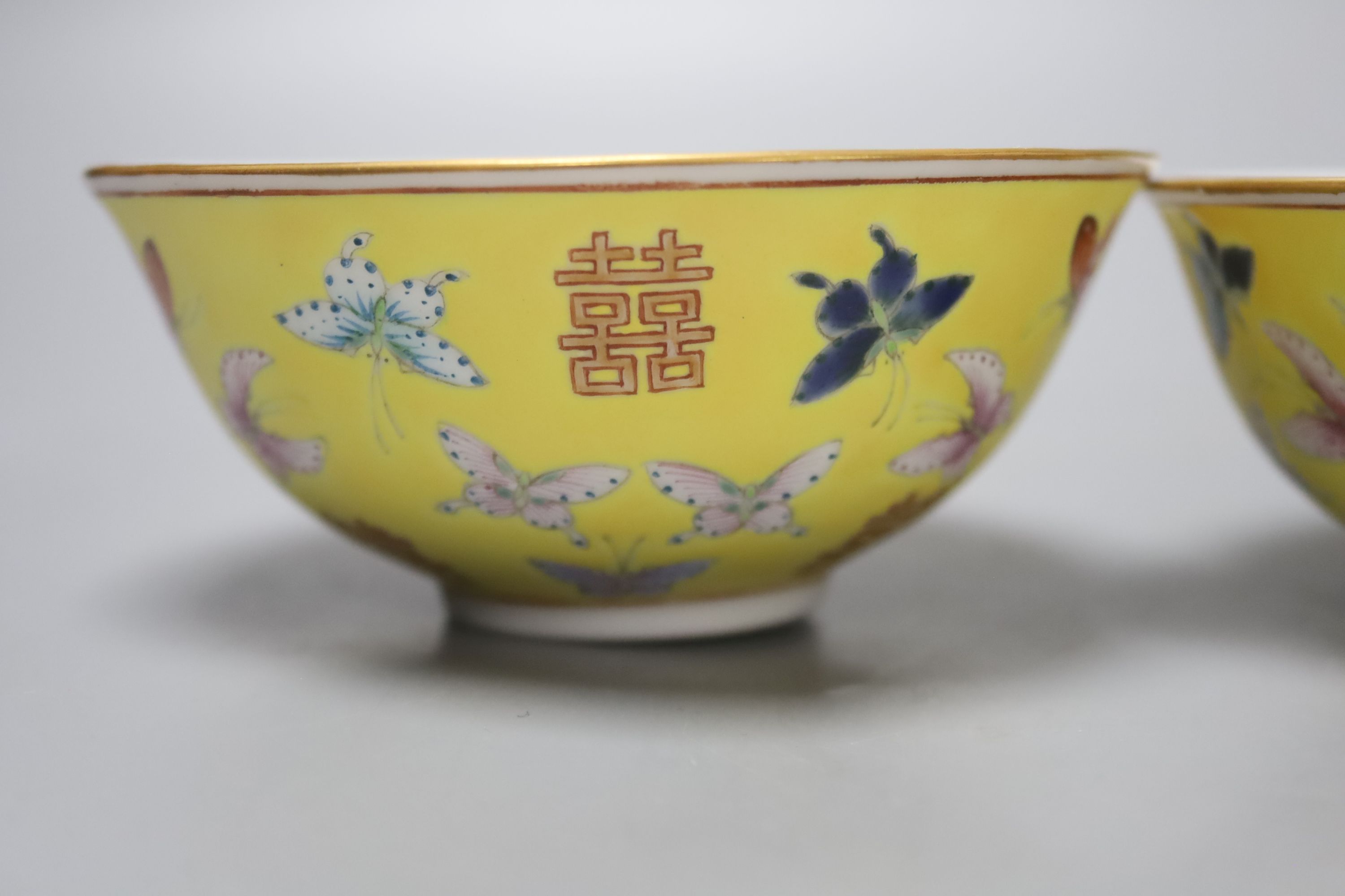 A set of four Chinese yellow ground rice bowls, diameter 11cm